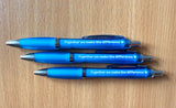 Three blue pens on a table with the message 'together we make the difference' written on them